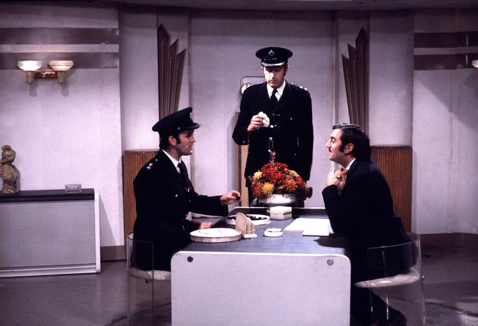 John Cleese as Inspector Praline, Graham Chapman as Superintendent Parrot, and Terry Jones as Mr Milton in the Crunchy Frog sketch.