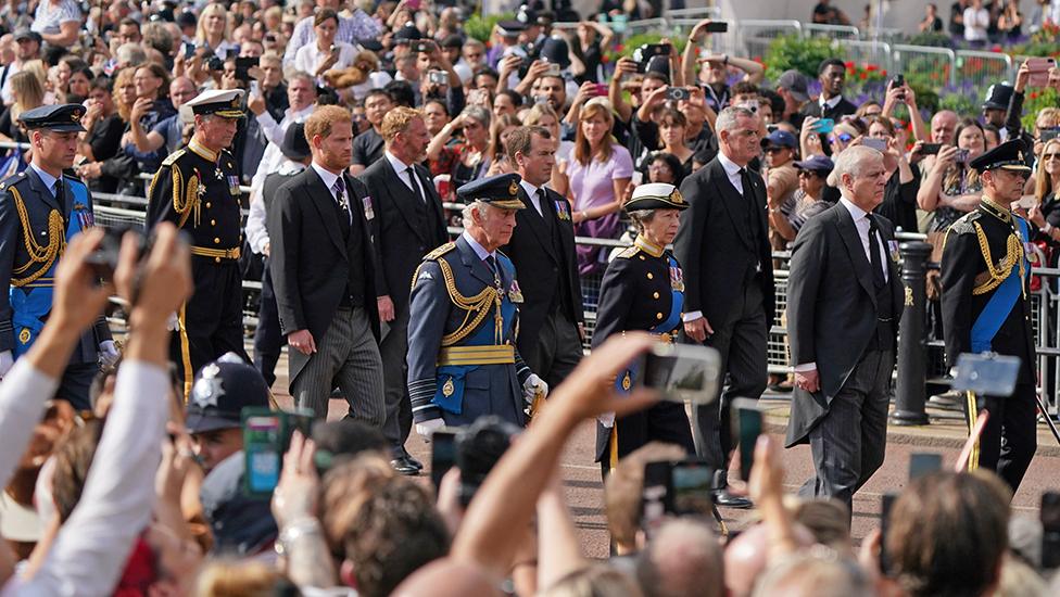 King Charles III and members of the royal family behind Queen Elizabeth II's flag-draped coffin as it is taken in procession on a Gun Carriage of The King's Troop Royal Horse Artillery from Buckingham Palace to Westminster Hall on 14 September 2022