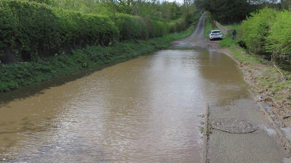 Sewage flooded road