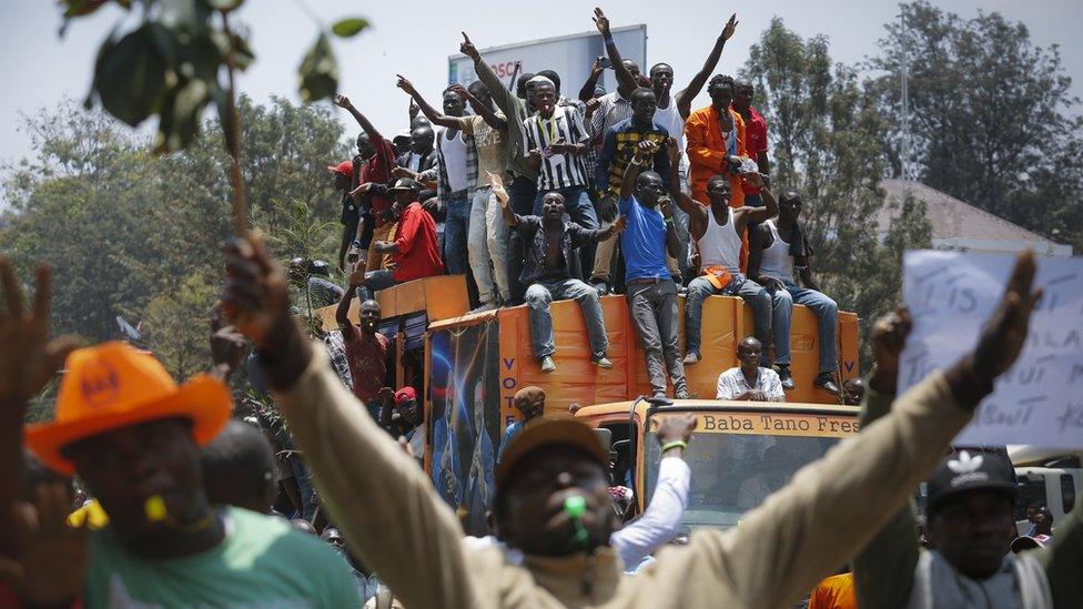 Supporters of the opposition coalition The National Super Alliance (NASA) and its presidential candidate Raila Odinga sit on top of a truck during their protest against the country"s electoral body Independent Electoral and Boundaries Commission (IEBC) in downtown Nairobi, Kenya, 26 September 2017