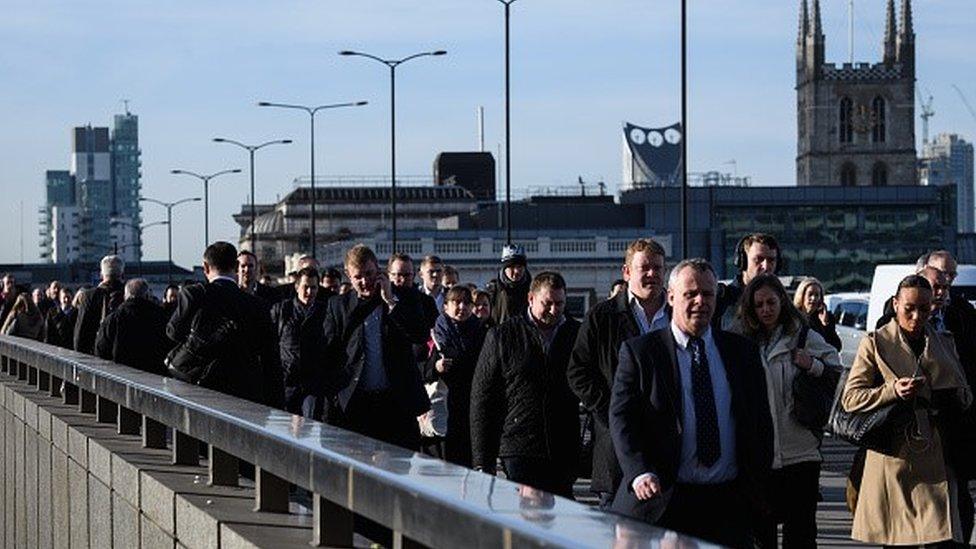 Commuters crossing London Bridge