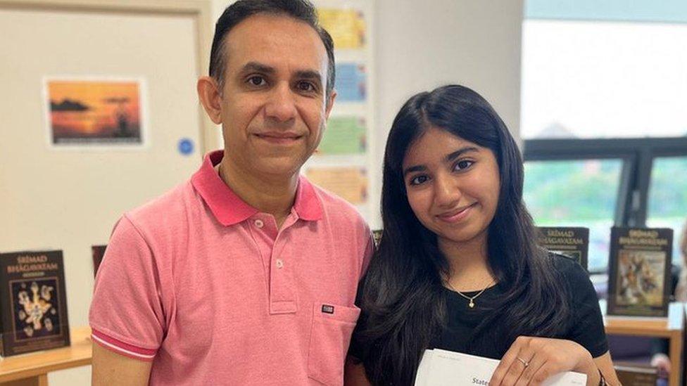 Hinal (right) collects her results with her father Shashikiran