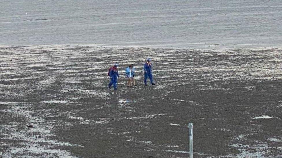 Teenagers and coastguard officers