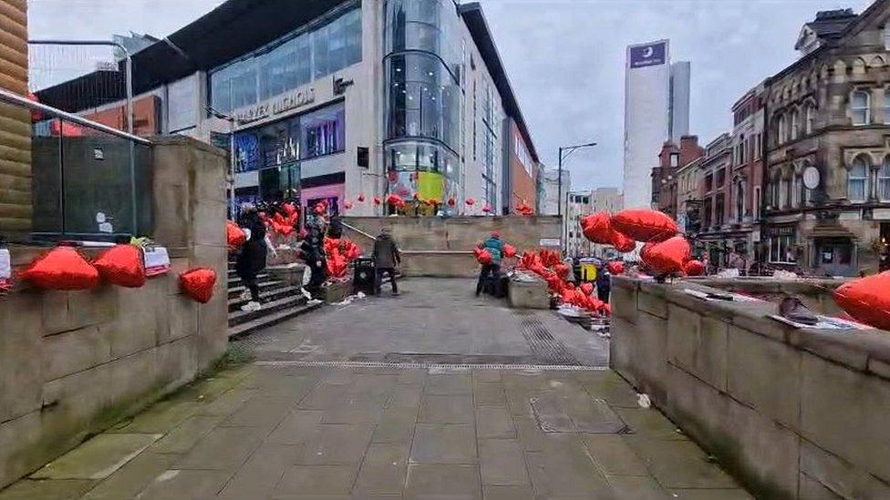 heart balloons at vigil in Manchester