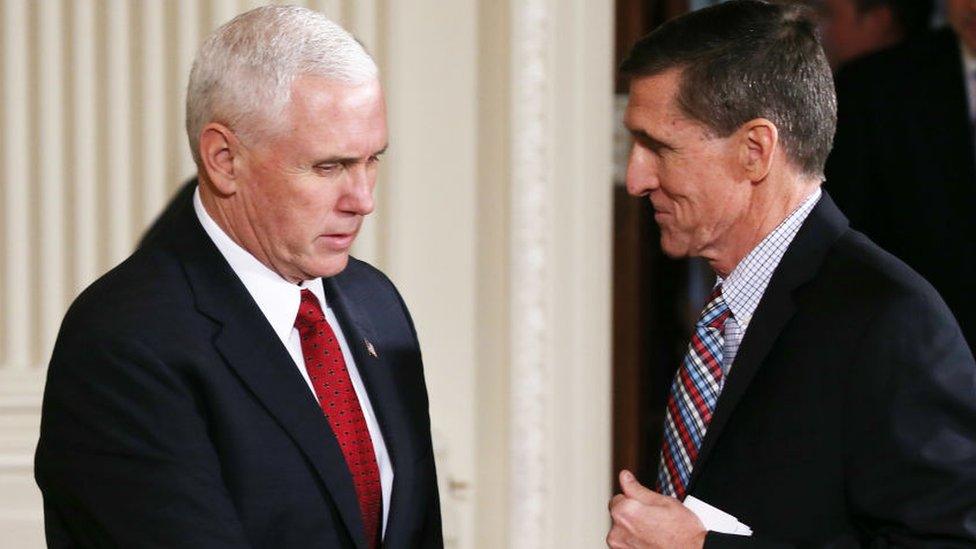 Vice-President Mike Pence and Michael Flynn shake hands.