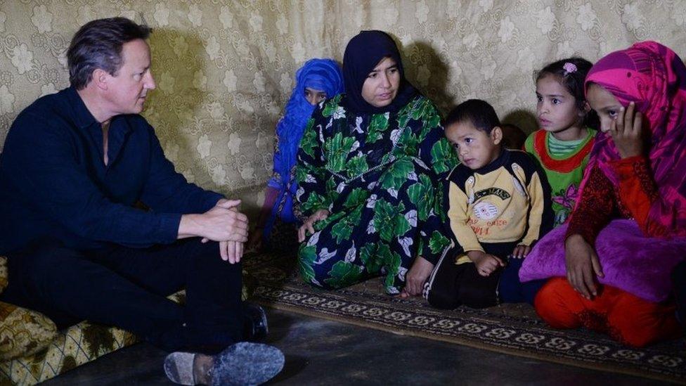 David Cameron meets Syrian refugee families at a tented settlement camp in the Bekaa Valley on the Syrian - Lebanese border