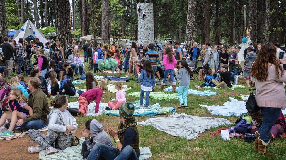 Parents and children attending a prior festival