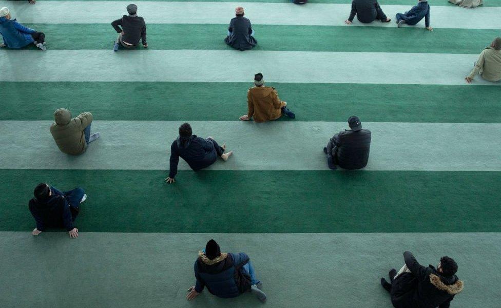 Friday Prayers At The Baitul Futuh Mosque Attendees distance themselves from others as Friday prayers are observed at the Baitul Futuh Mosque on March 20, 2020 in London, England. The Mosque usually attracts around 7000 people to Friday prayer but only a few hundred came this week due to the ongoing COVID-19 crisis. Coronavirus (Covid-19) has spread to at least 182 countries, claiming over 10,000 lives and infecting more than 250,000 people