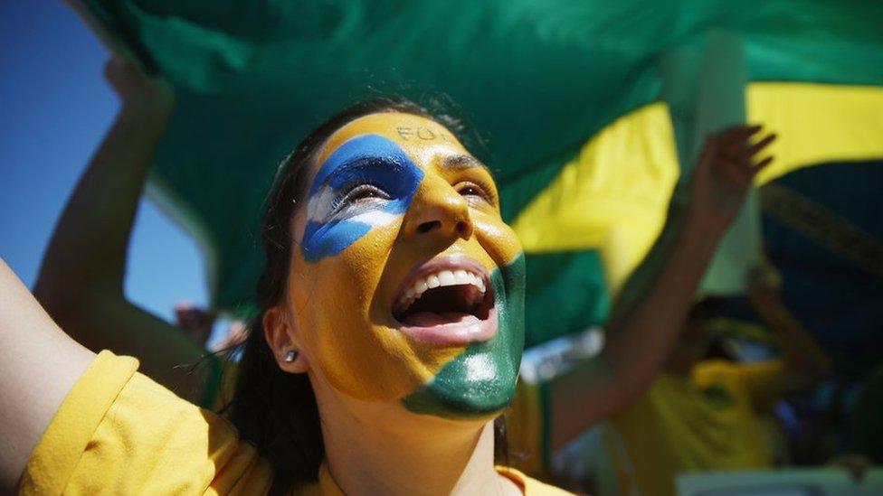 A protester calling for the impeachment of President Dilma Rousseff cheers along Copacabana beach on 16 August 2015