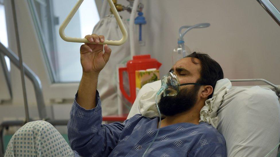 A wounded MSF staff member receives treatment in hospital in Kabul, 6 October 2015.