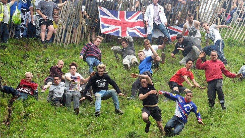 Cheese-rolling chasers at Cooper's Hill