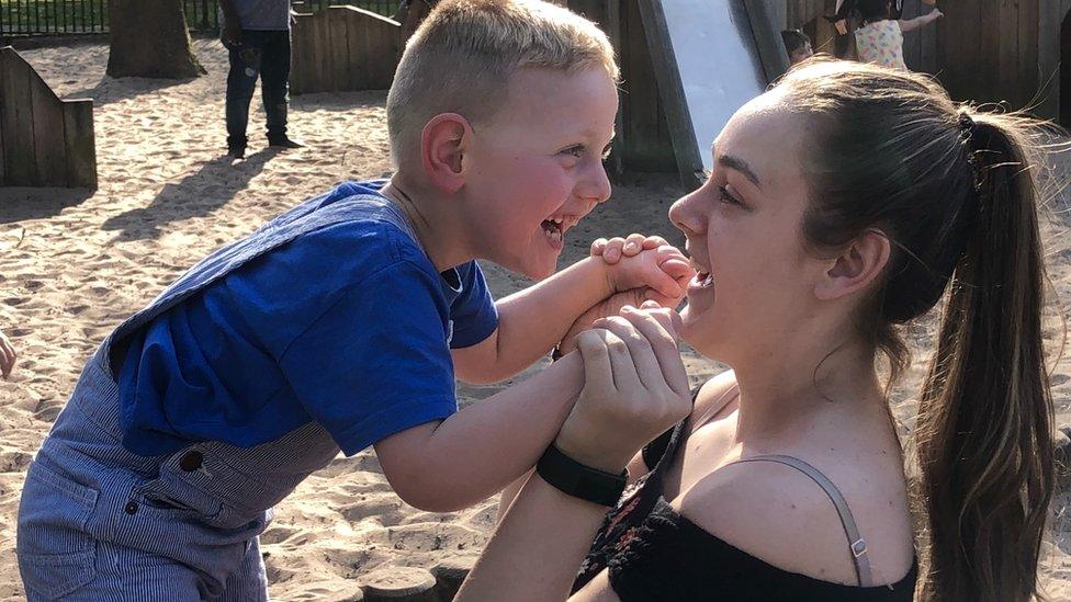 Christian and Jade playing in the park together