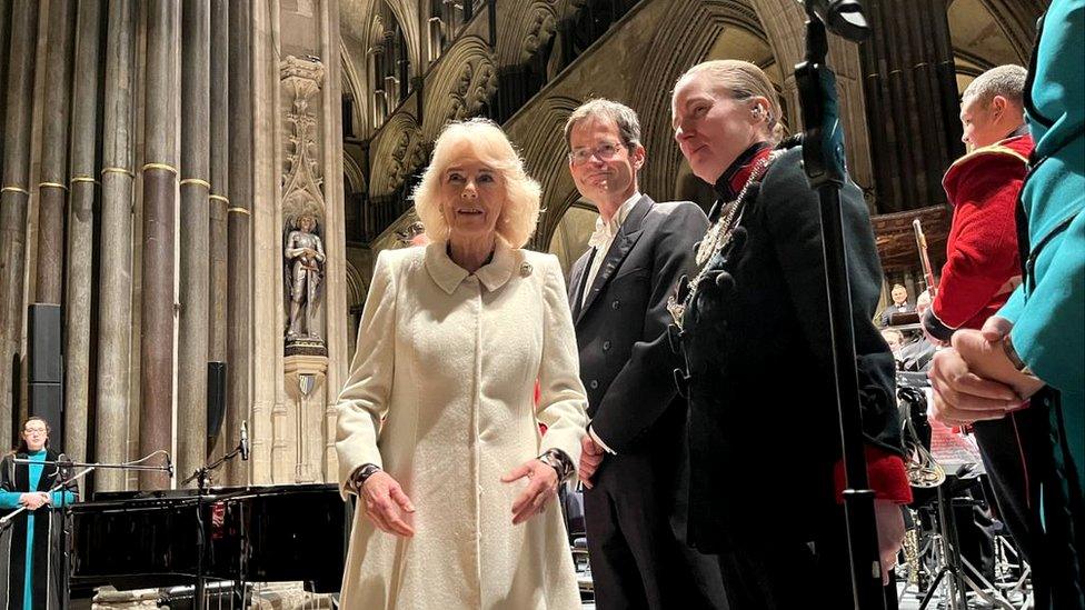 Queen Camilla in a white coat