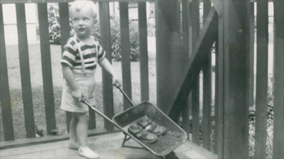 Donald Trump as a child with wheel barrow