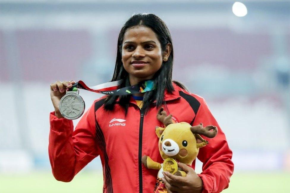 Silver medalist Dutee Chand of India poses on the podium during the medal ceremony for the Women's 200 metres event at the Asian Games 2018 in Jakarta, Indonesia, 29 August 2018