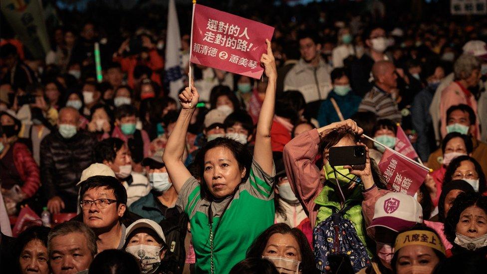 Supporters of the ruling Democratic Progressive Party (DPP) listen during a campaign rally in Kaohsiung on January 7, 2024