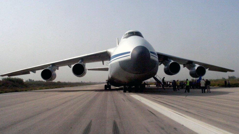 Picture released by Syrian Arab News Agency (SANA) shows Russian plane carrying humanitarian aid being unloaded at Martyr Bassil al-Assad international airport in Latakia. 12 Sept 2015