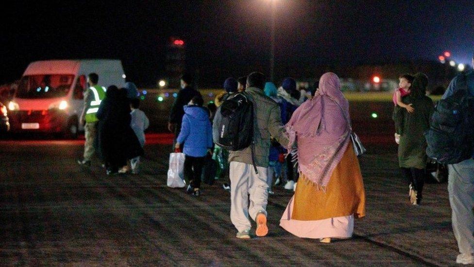 British nationals and Afghan evacuees depart a flight from Afghanistan at RAF Brize Norton on 17 August 2021