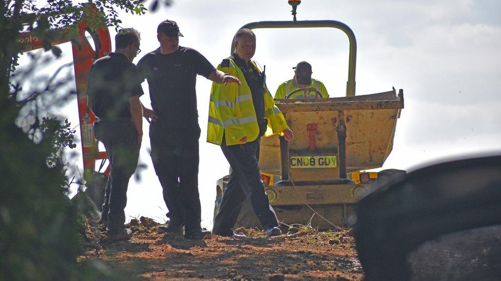 Police officers search an area near Pershore in Worcestershire