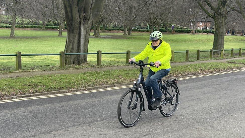 Meryl Knapp using a borrowed bike