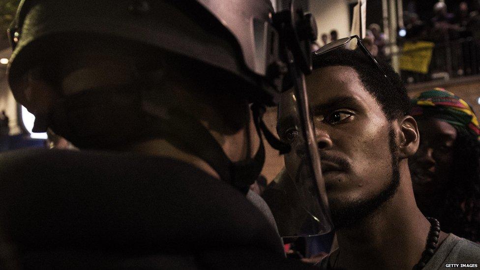 A protestor comes toe-to-toe with a police officer in Charlotte overnight