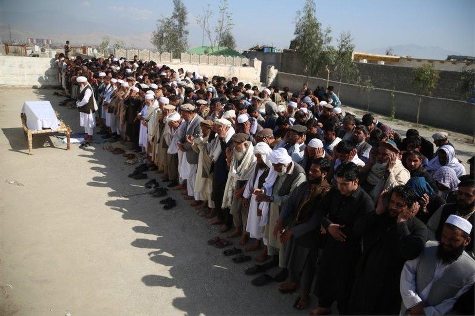 Relatives attend the funeral of Sadia Sadat, one of the three Afghan female journalists of Enikass Radio Television Network, in Jalalabad, Afghanistan, 03 March 2021.