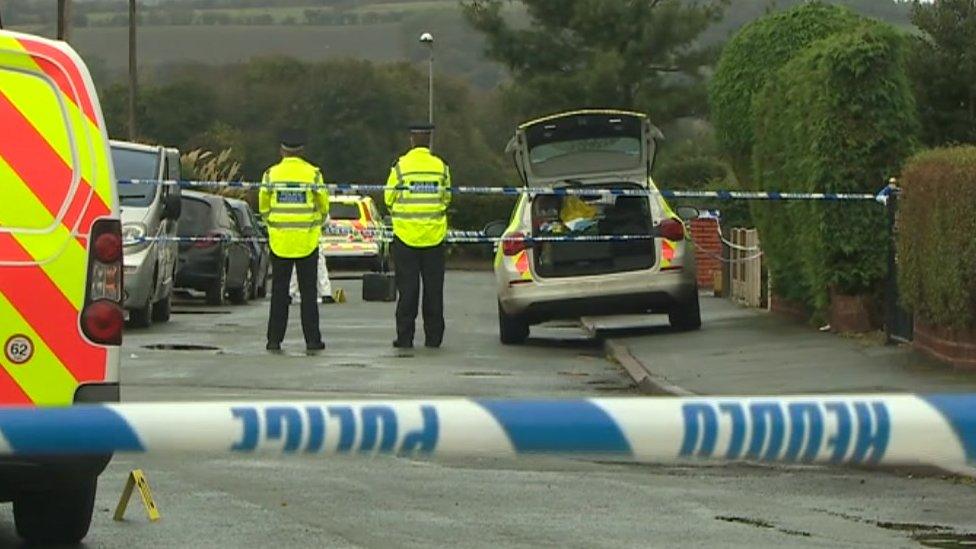 Police at the scene in Llay