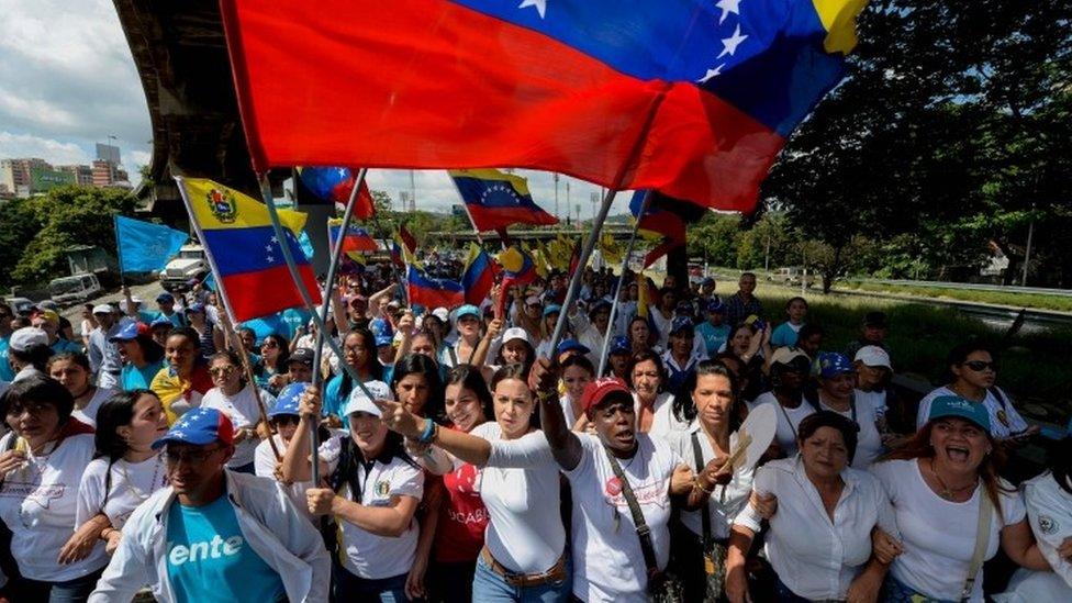 A group of women, led by Lilian Tintori, wife of imprisoned opposition Leopoldo Lopez, march in Caracas to protest the suspension of the recall referendum. 22 Oct 2016