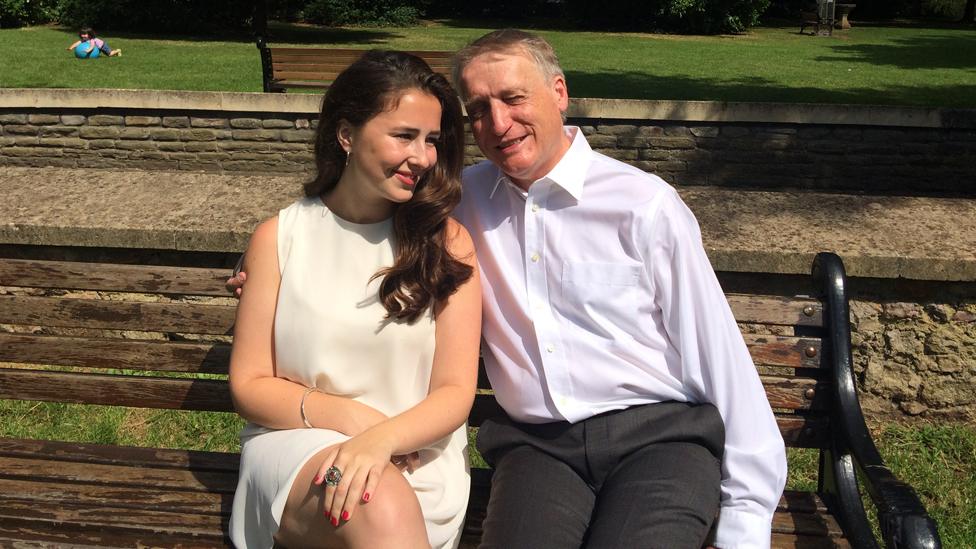 Caitlin and Mike Lambert sitting on a park bench
