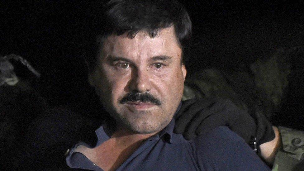 Joaquin "El Chapo" Guzman escorted into a helicopter at Mexico City's airport following his recapture in Los Mochis, in Sinaloa State. 8 Jan 2016