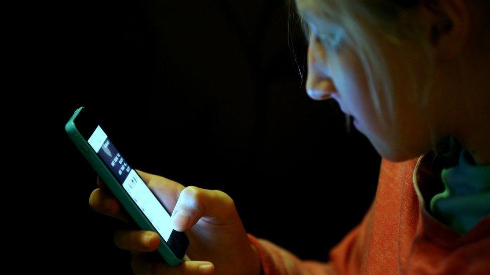 Kid using a mobile phone