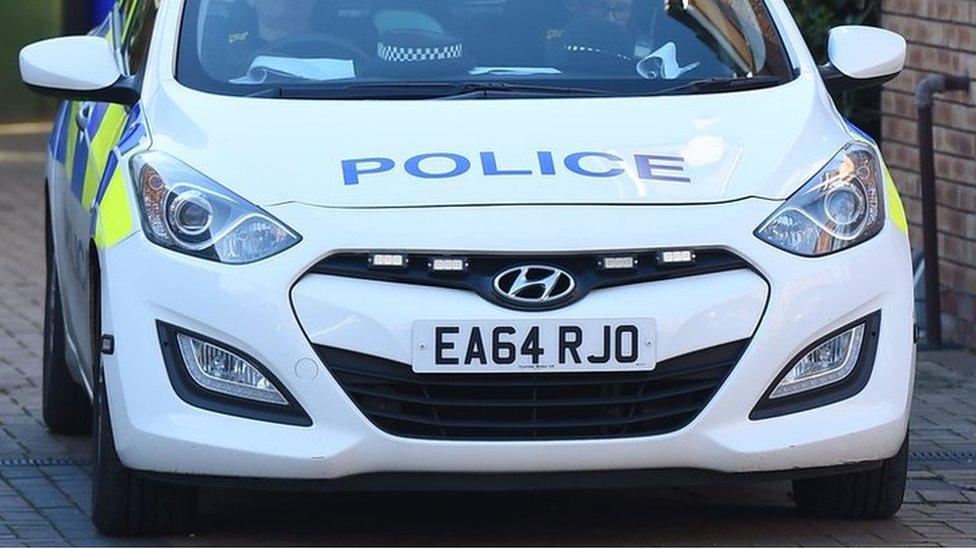 A police car parked outside a house in London