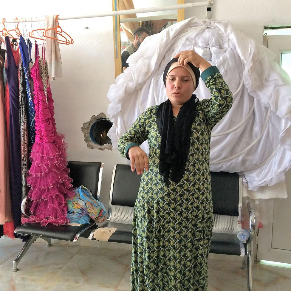 Rozhin in her salon-cum-gown-hire shop