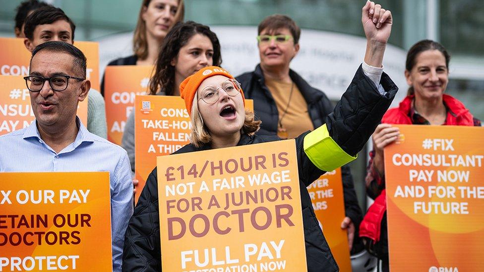 Junior doctors and consultants at University College Hospital London with placards