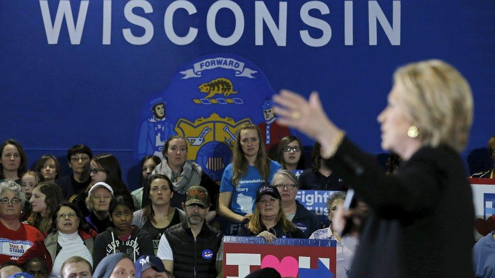 Supporters listens to U.S. Democratic presidential candidate Hillary Clinton speak at a campaign event in Milwaukee, Wisconsin, United States, March 28, 2016