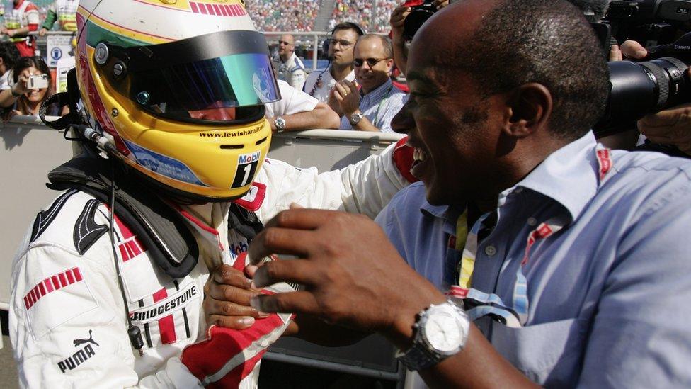 Lewis Hamilton of Great Britain celebrates winning with his father after round six of the GP2 series on June 11, 2006 at Silverstone, England.