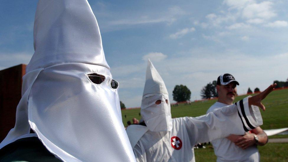 Members of the Knights of the Ku Klux Klan participate in a neo-Nazi rally on the amphitheatre stage at Valley Forge National Historic Park, in Valley Forge, Pa.