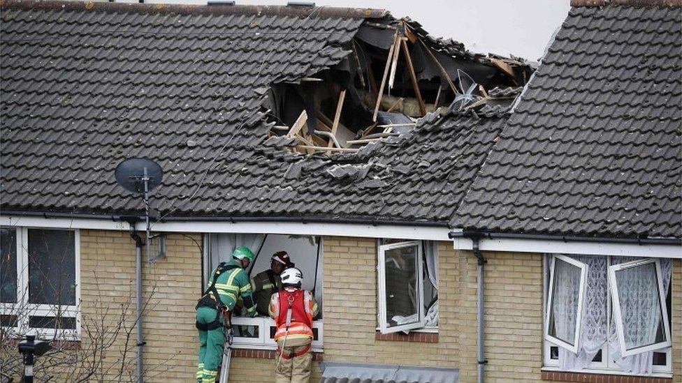 Damaged house and emergency services