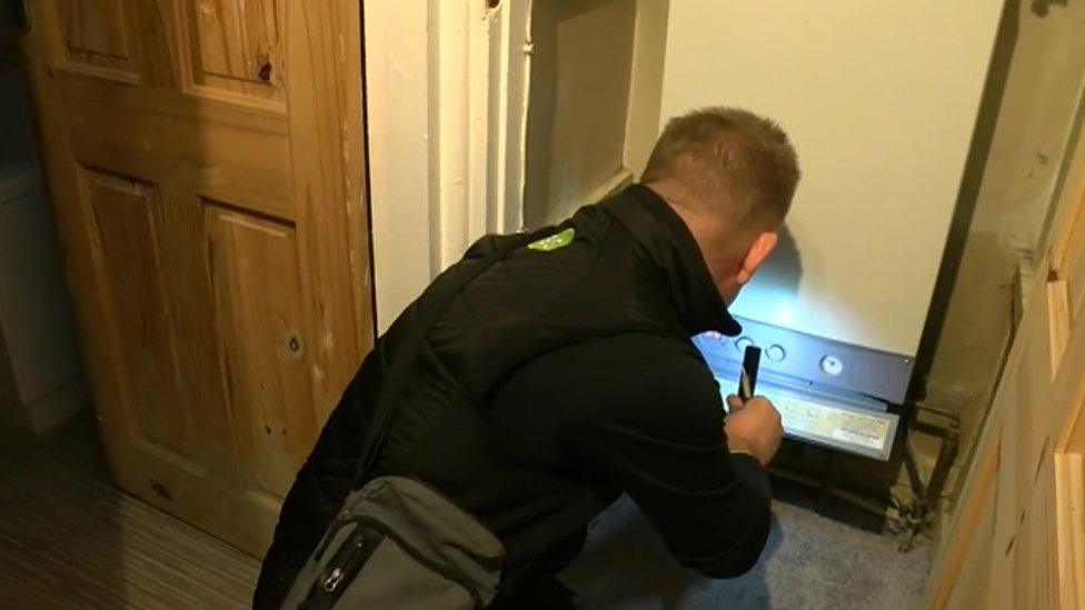 Man checking boiler