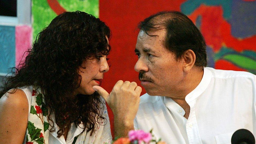 Rosario Murillo talks closely to the president of Nicaragua, Daniel Ortega