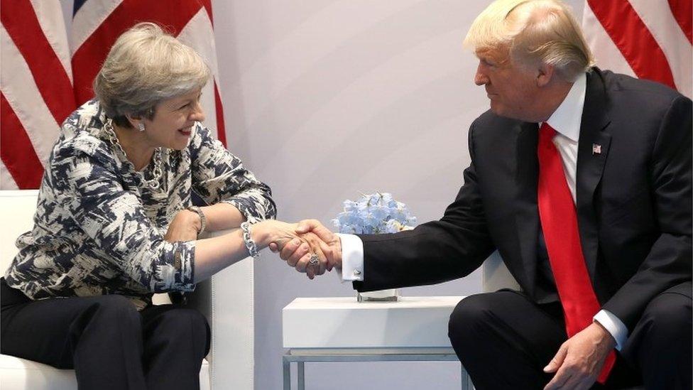 Theresa May and Donald Trump shake hands