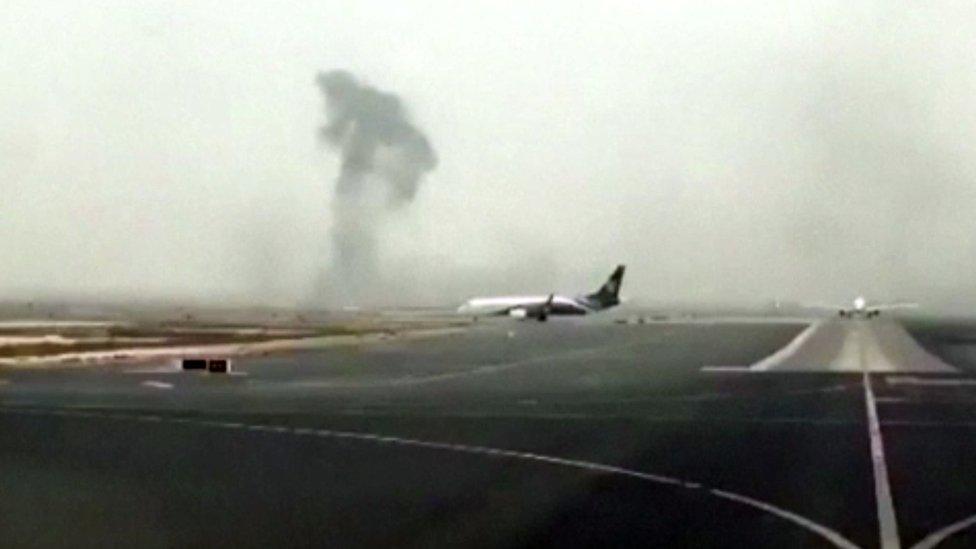 This image made from video shows smoke rising after an Emirates flight crash landed at Dubai International Airport on Wednesday, 3 Aug 2016.