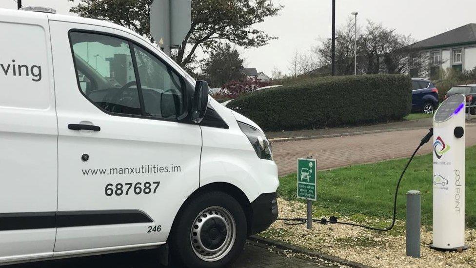 Van parked at electric vehicle charging point