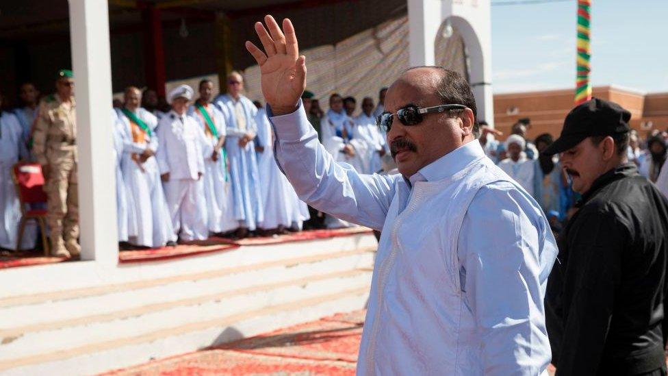 Mauritanian President Mohamed Ould Abdel Aziz waves to the crowd as he arrives to launch the "Festival des villes anciennes" (Ancient cities Festival) in Oualata, southeastern Mauritania.