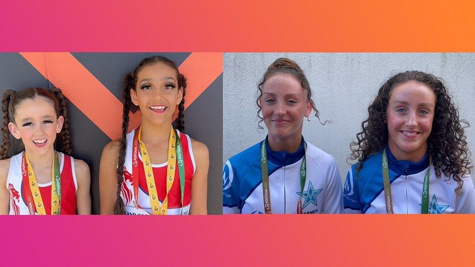 Four girls smiling at camera