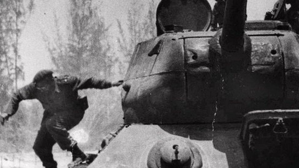 Fidel Castro leaps from a tank