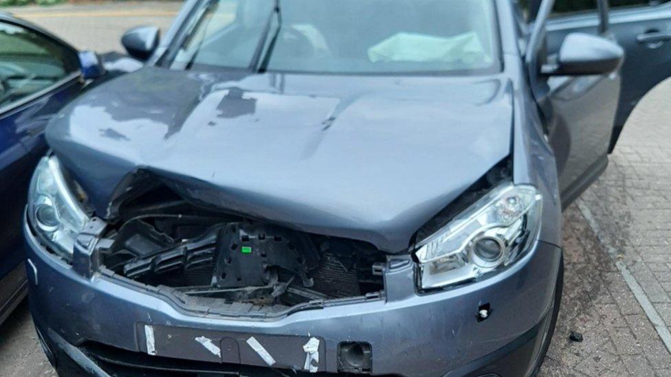 Damaged grey Nissan Qashqai