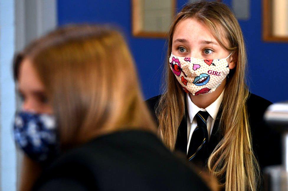 Pupil wearing mask in classroom