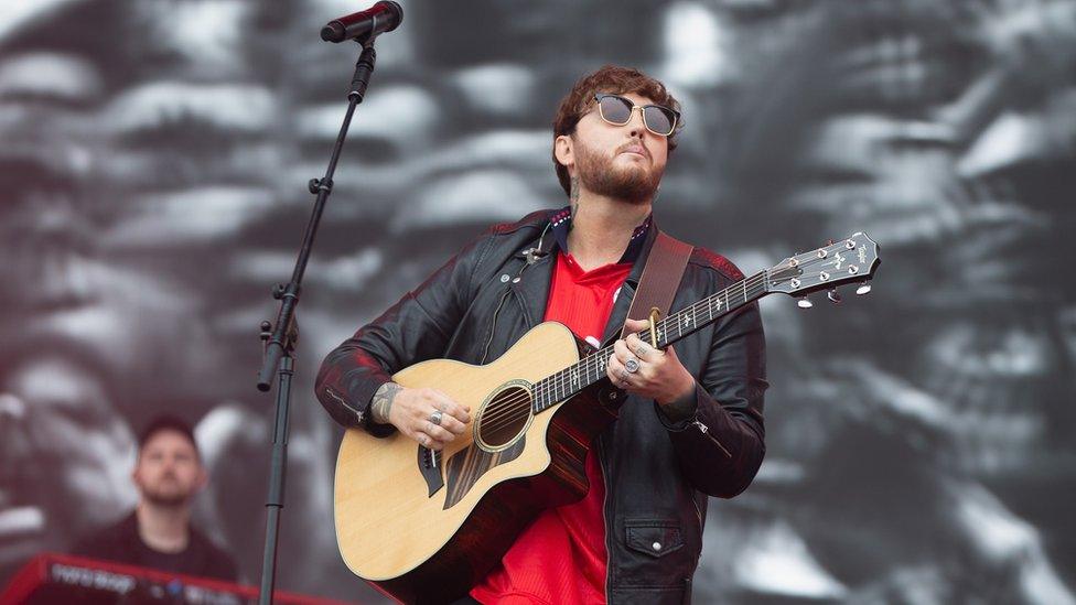 James Arthur playing guitar