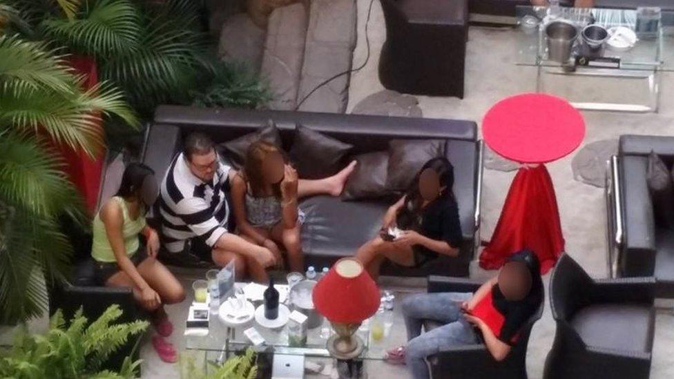 Rurik Jutting with a group of women. He has described his fantasies of torturing women to psychiatrists